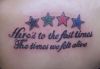 colorful stars and text tattoo